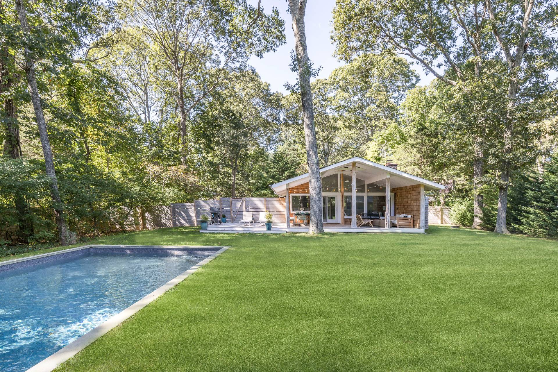 49 Sherwood Lane East Hampton, NY 11937 - Photo 1 of 19 a view of a house with a yard