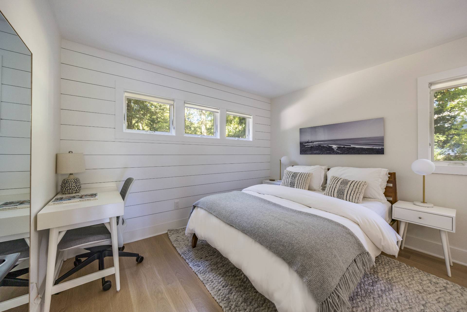 49 Sherwood Lane East Hampton, NY 11937 - Photo 16 of 19 a bedroom with a bed and a chair