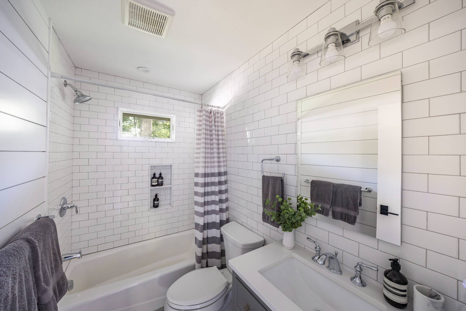 49 Sherwood Lane East Hampton, NY 11937 - Photo 18 of 19 a bathroom with a granite countertop toilet sink tub and shower