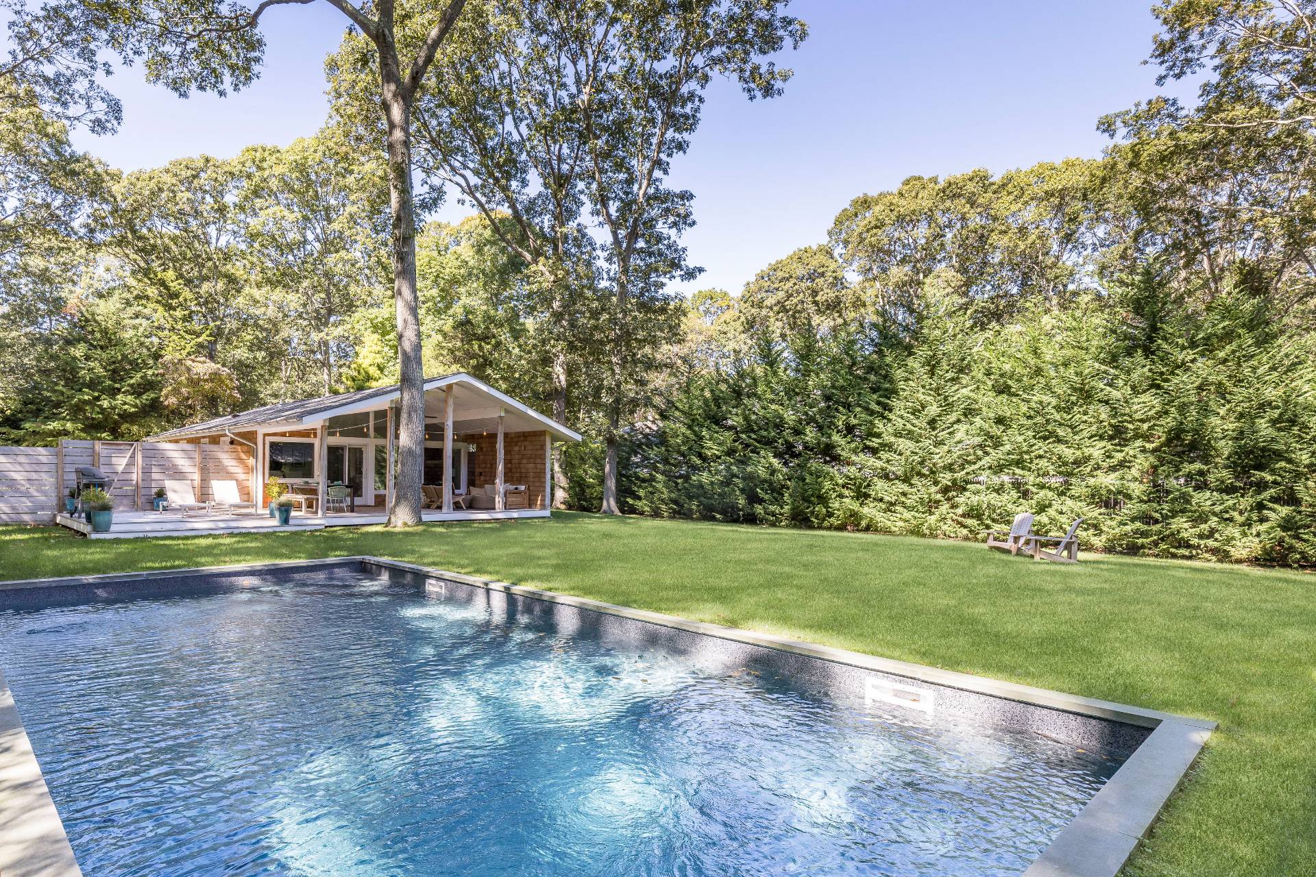 49 Sherwood Lane East Hampton, NY 11937 - Photo 2 of 19 a view of a house with a yard