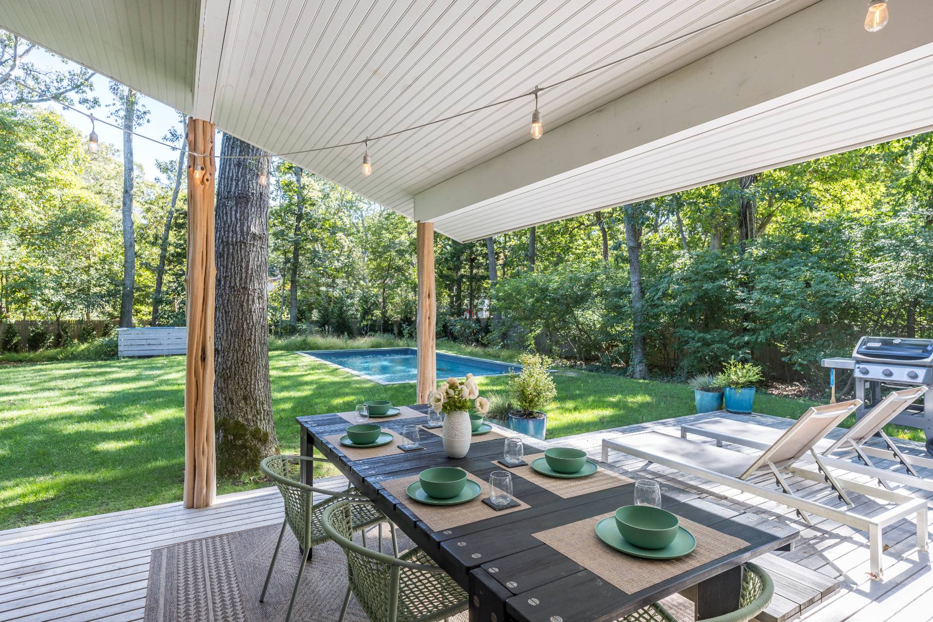 49 Sherwood Lane East Hampton, NY 11937 - Photo 6 of 19 a view of yard from deck with patio