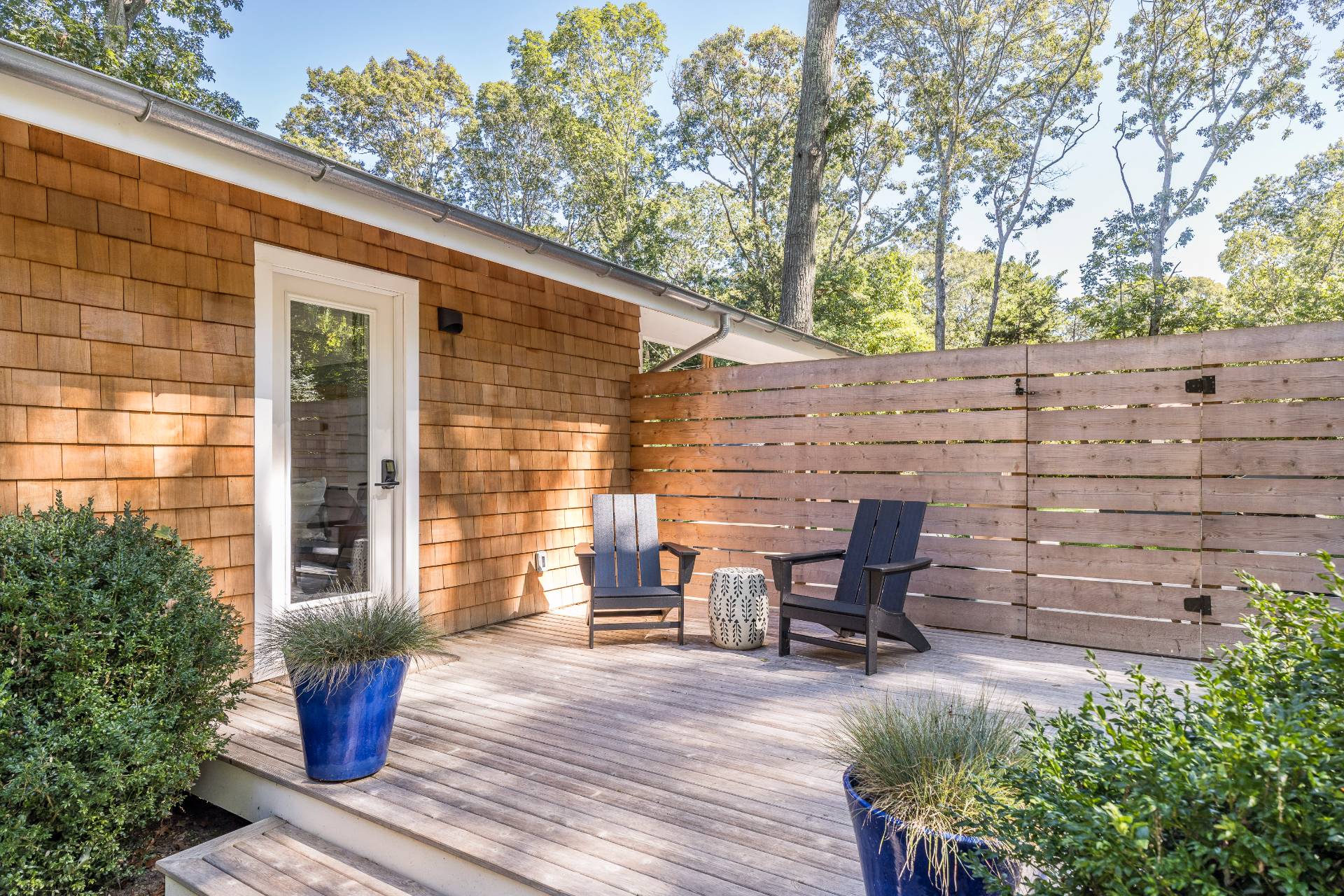 49 Sherwood Lane East Hampton, NY 11937 - Photo 8 of 19 a view of a chairs and table in the patio