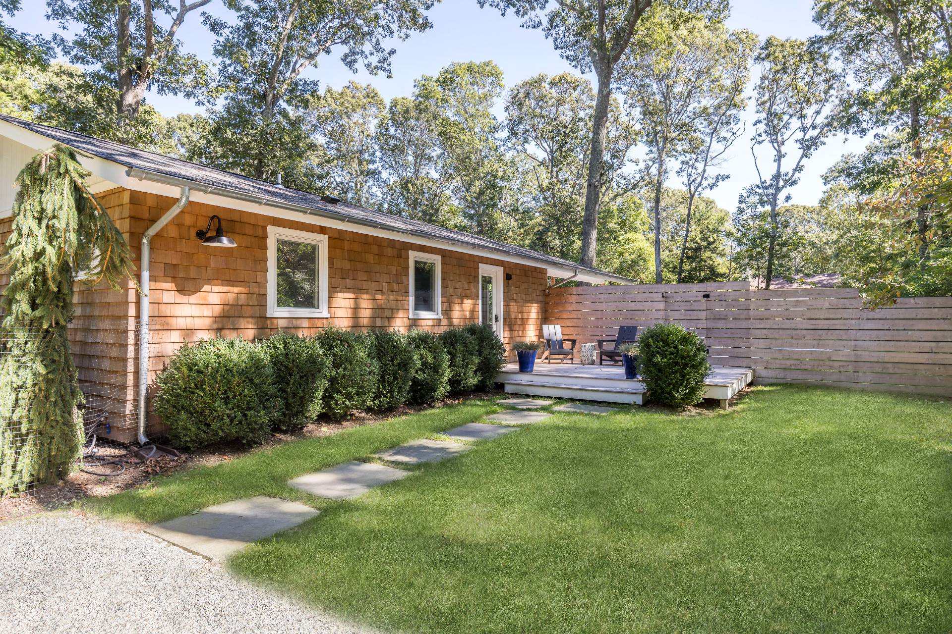 49 Sherwood Lane East Hampton, NY 11937 - Photo 9 of 19 a view of a house with a yard and plants