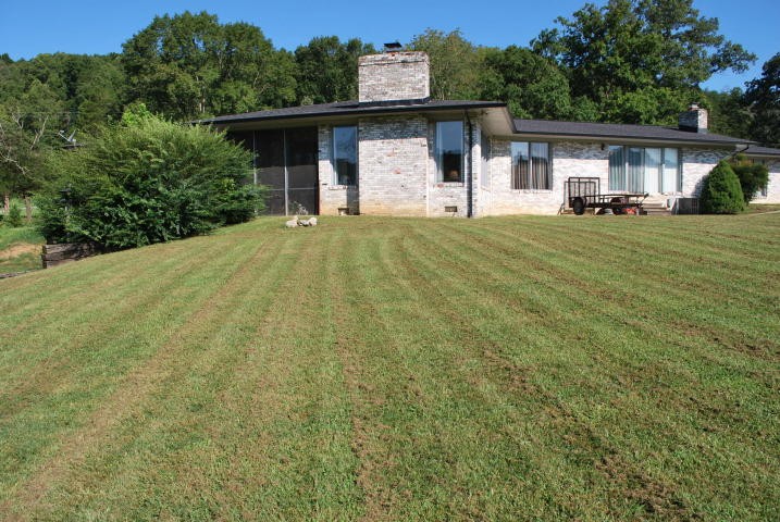 2736 East Raccoon Valley Drive Heiskell, TN 37754 - Photo 18 of 37 a front view of a house with a yard