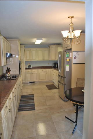 2736 East Raccoon Valley Drive Heiskell, TN 37754 - Photo 20 of 37 a large kitchen with a table and chairs