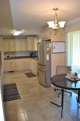 2736 East Raccoon Valley Drive Heiskell, TN 37754 - Photo 21 of 37 a kitchen with stainless steel appliances a stove a refrigerator and cabinets
