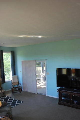 2736 East Raccoon Valley Drive Heiskell, TN 37754 - Photo 27 of 37 a living room with furniture and a flat screen tv