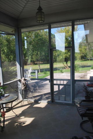 2736 East Raccoon Valley Drive Heiskell, TN 37754 - Photo 28 of 37 a view of a porch with furniture and yard