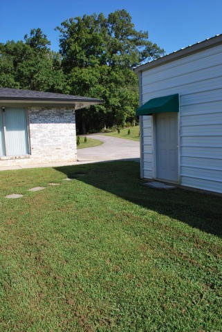 2736 East Raccoon Valley Drive Heiskell, TN 37754 - Photo 36 of 37 a view of house with backyard and garden
