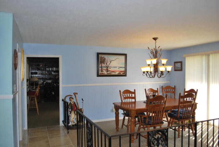 2736 East Raccoon Valley Drive Heiskell, TN 37754 - Photo 7 of 37 a view of a dining room with furniture and chandelier