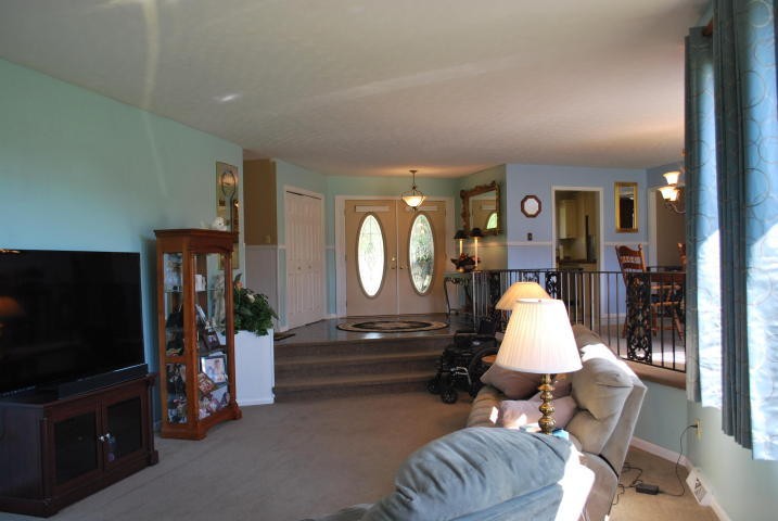 2736 East Raccoon Valley Drive Heiskell, TN 37754 - Photo 8 of 37 a living room with furniture a flat screen tv and a fireplace