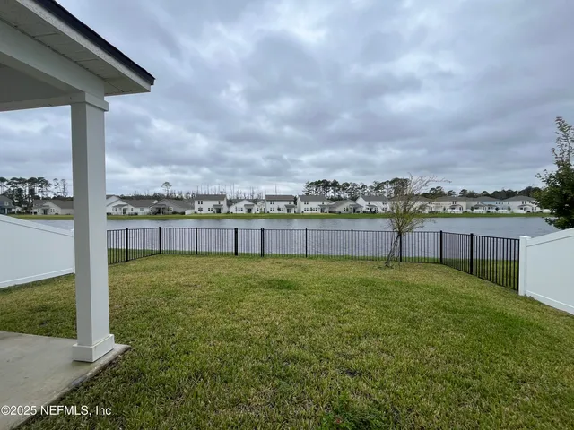 view of a hallway with paintings on wall