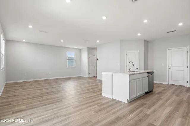 a view of kitchen with furniture and wooden floor