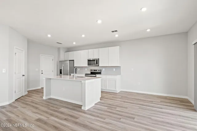 a view of kitchen with wooden floor