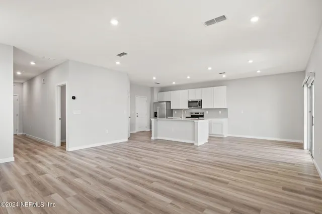 a view of kitchen with wooden floor