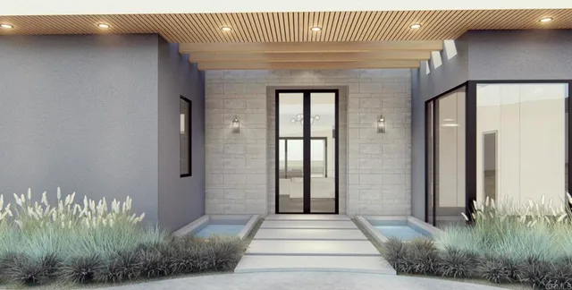 a front view of a house with a garden