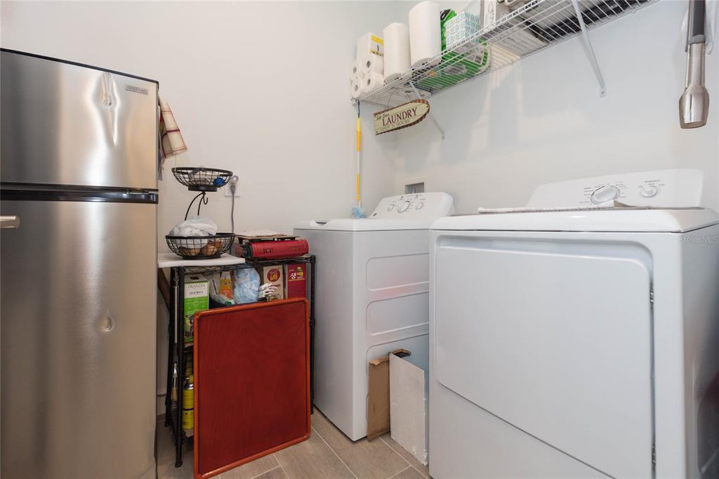10806 Gable Dig Loop San Antonio, FL 33576 - Photo 21 of 73 a utility room with dryer and washer