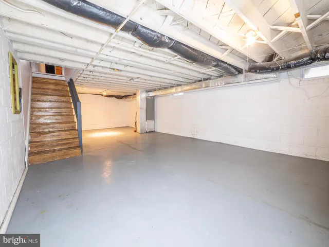 a view of a room with stairs and a window