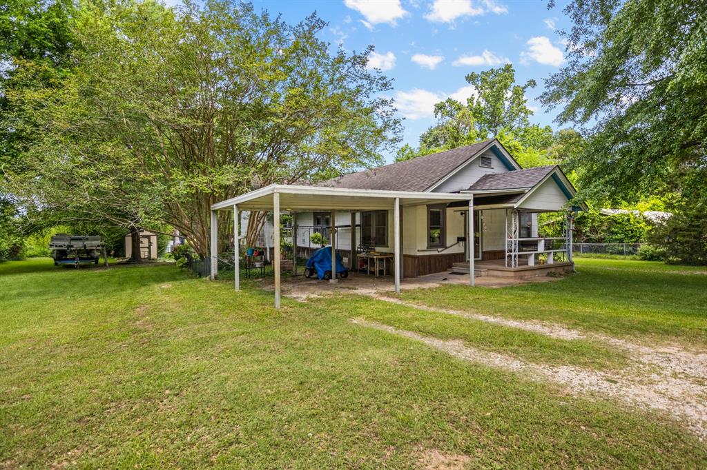 103 South Sun Camp Road White Oak, TX 75693 - Photo 3 of 40 a view of a house with a swimming pool