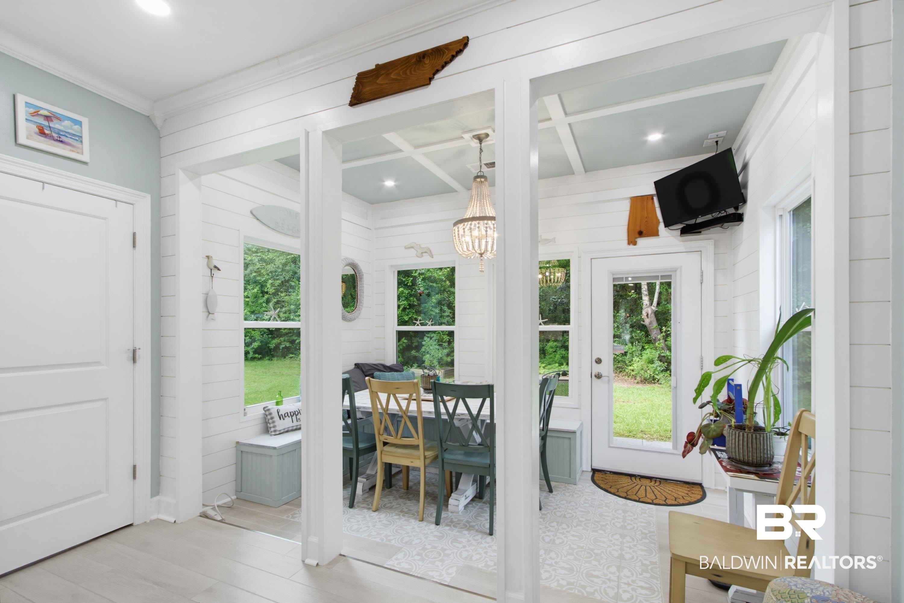7472 Coopers Landing Road Foley, AL 36535 - Photo 12 of 40 Dining Room featuring white shiplap walls, a light blue coffered ceiling, and direct outdoor access