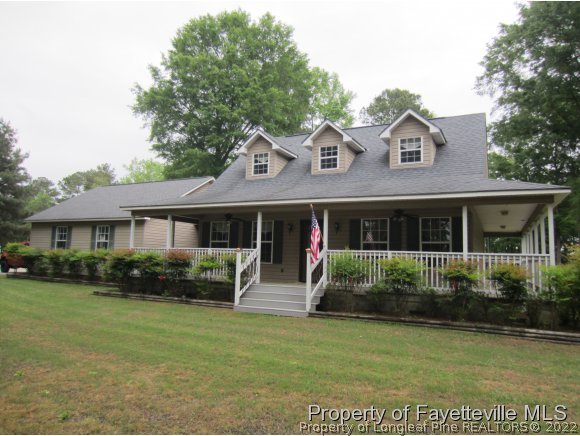 8716 Godwin-Falcon Road Godwin, NC 28344 - Photo 1 of 25 a front view of a house with garden