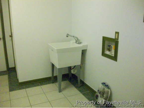8716 Godwin-Falcon Road Godwin, NC 28344 - Photo 14 of 25 a bathroom with a sink and a mirror