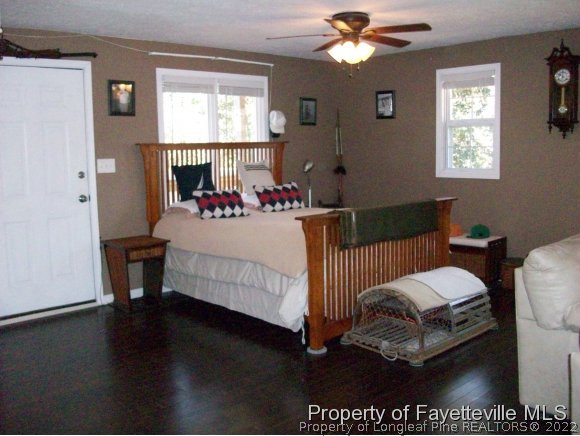 8716 Godwin-Falcon Road Godwin, NC 28344 - Photo 20 of 25 a bedroom with a bed and window