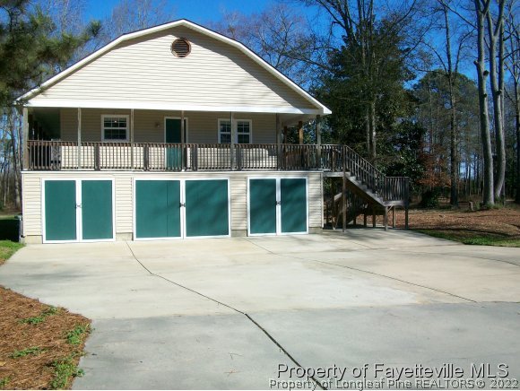 8716 Godwin-Falcon Road Godwin, NC 28344 - Photo 22 of 25 a front view of a house with a garden