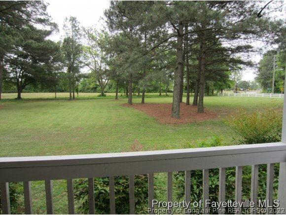 8716 Godwin-Falcon Road Godwin, NC 28344 - Photo 3 of 25 a garden view with a seating space