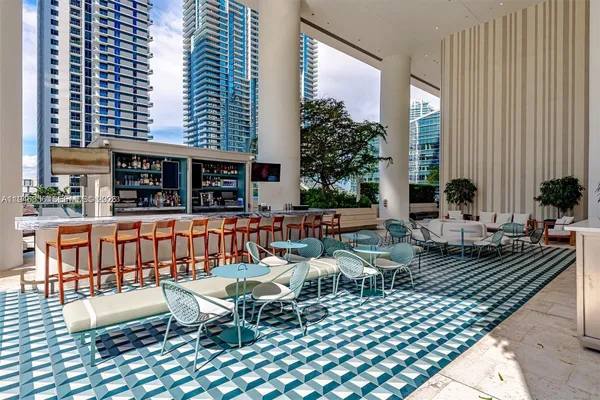 a view of swimming pool with outdoor seating