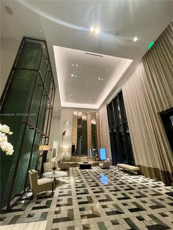 a room with a table chairs and wooden floor