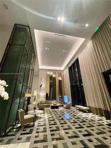 a room with a table chairs and wooden floor