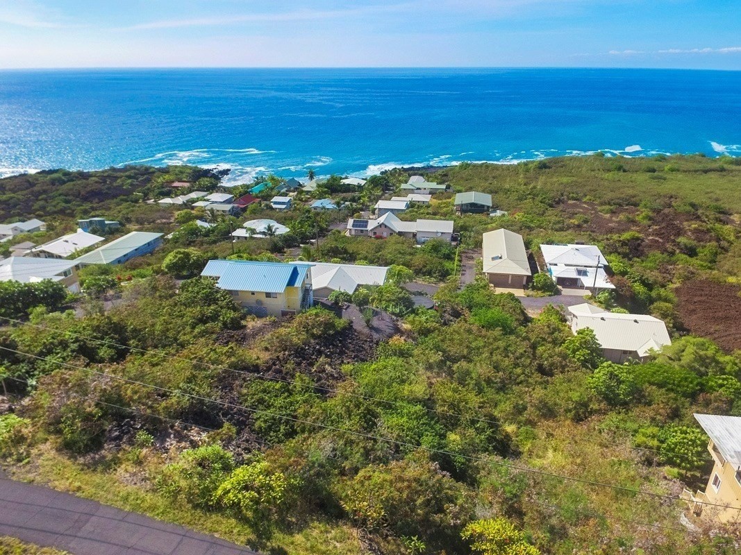 263 Japonica Road Captain Cook, HI 96704 - Photo 6 of 10 a view of a large body of water with a building in the background