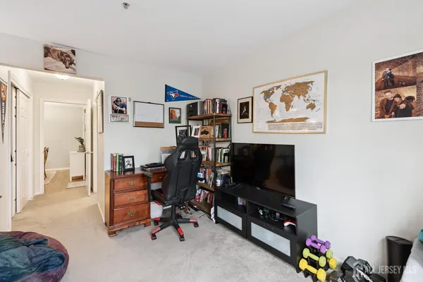 a view of a livingroom with workspace and a couch