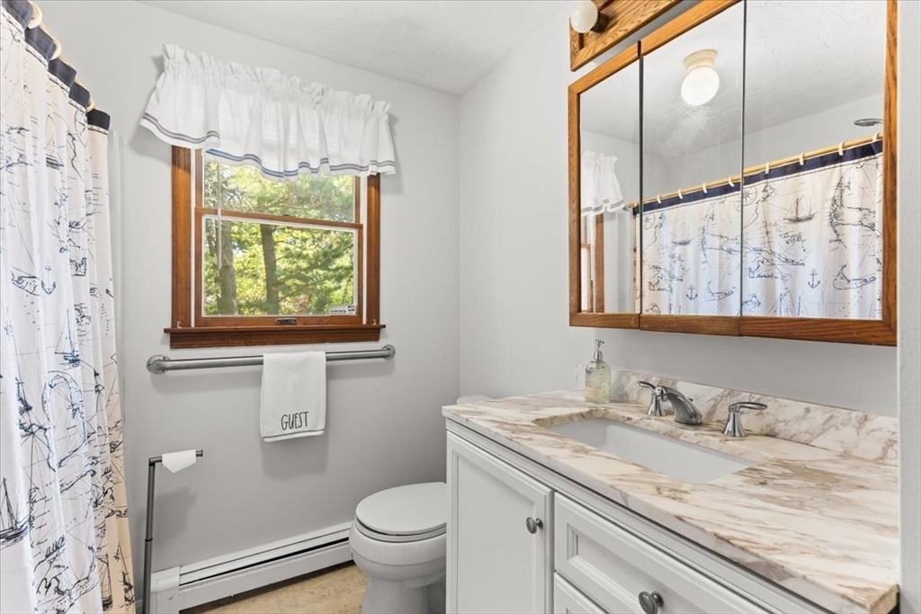 83 Red Brook Road Wareham, MA 02532 - Photo 14 of 36 a bathroom with a granite countertop sink toilet and mirror