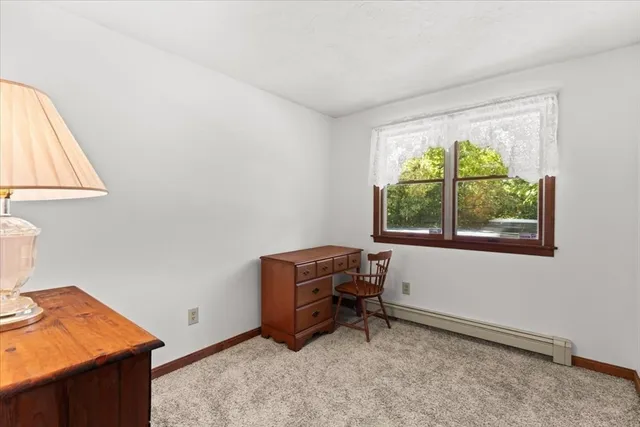 a room with furniture and a window