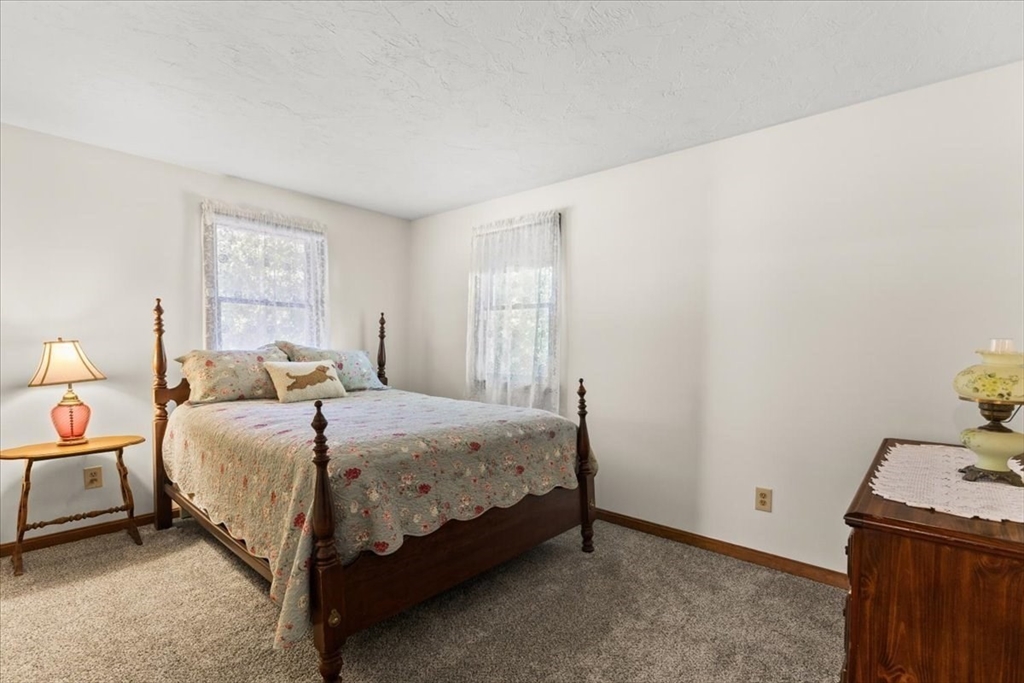 83 Red Brook Road Wareham, MA 02532 - Photo 18 of 36 a bedroom with a bed and a window