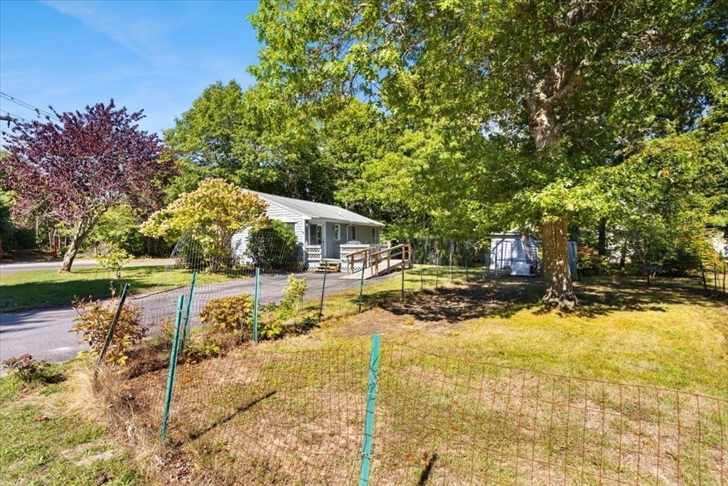 83 Red Brook Road Wareham, MA 02532 - Photo 23 of 36 a view of swimming pool with sitting area and garden