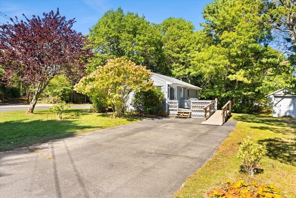 83 Red Brook Road Wareham, MA 02532 - Photo 24 of 36 a house with swimming pool in front of it