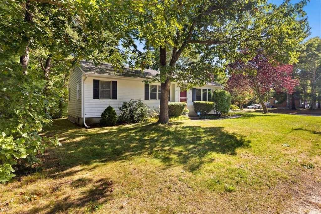 83 Red Brook Road Wareham, MA 02532 - Photo 26 of 36 a front view of house with yard and green space