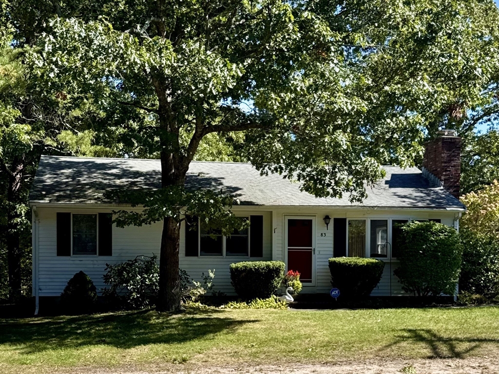 83 Red Brook Road Wareham, MA 02532 - Photo 27 of 36 a front view of a house with a yard and a garden