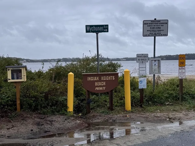 a sign that is on the side of a tree