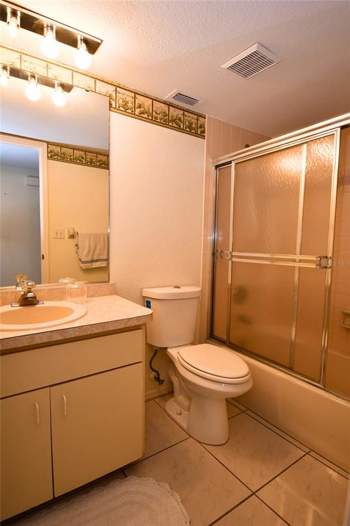 2275 South McCall Road, Unit 103 Englewood, FL 34224 - Photo 11 of 17 a bathroom with a sink toilet and shower