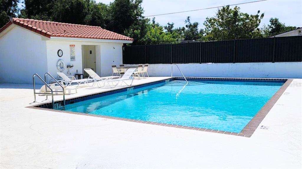 2275 South McCall Road, Unit 103 Englewood, FL 34224 - Photo 13 of 17 a view of swimming pool with seating space