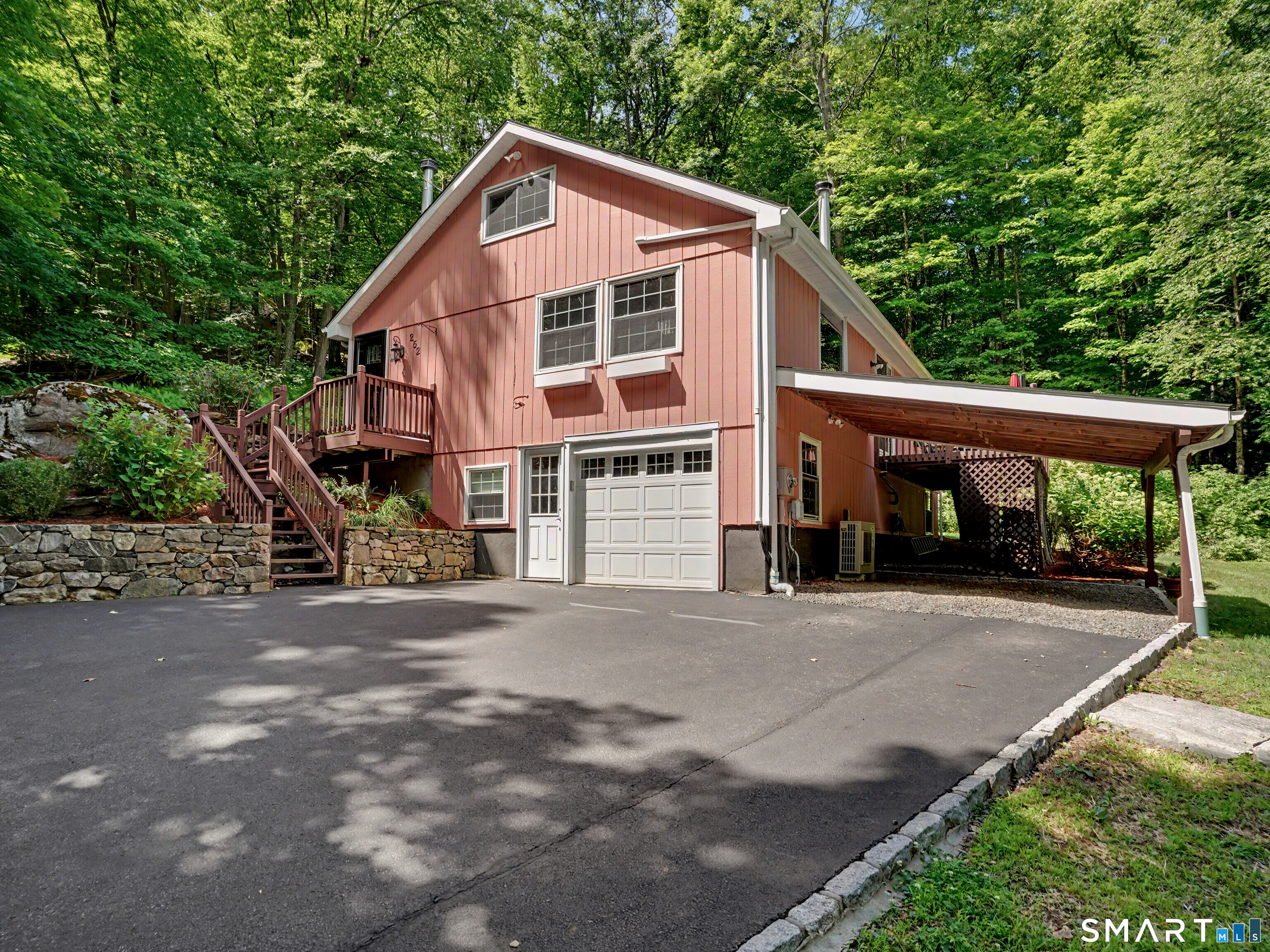 252 Bennetts Farm Road Ridgefield, CT 06877 - Photo 1 of 40 Welcome to 252 Bennetts Farm Road, where peace & privacy converge in a beautiful natural setting.