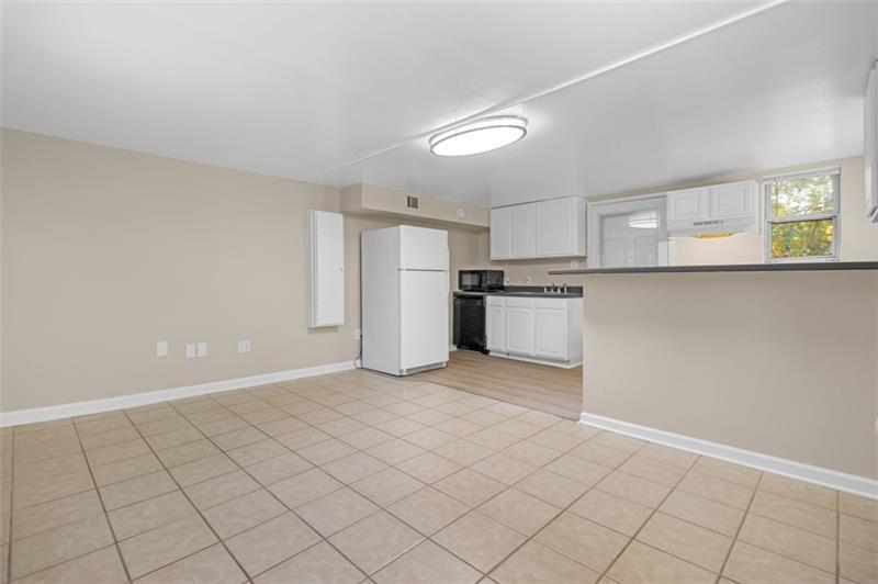 2958 Harcourt Drive Decatur, GA 30033 - Photo 4 of 11 a view of a kitchen with a sink cabinets and a window