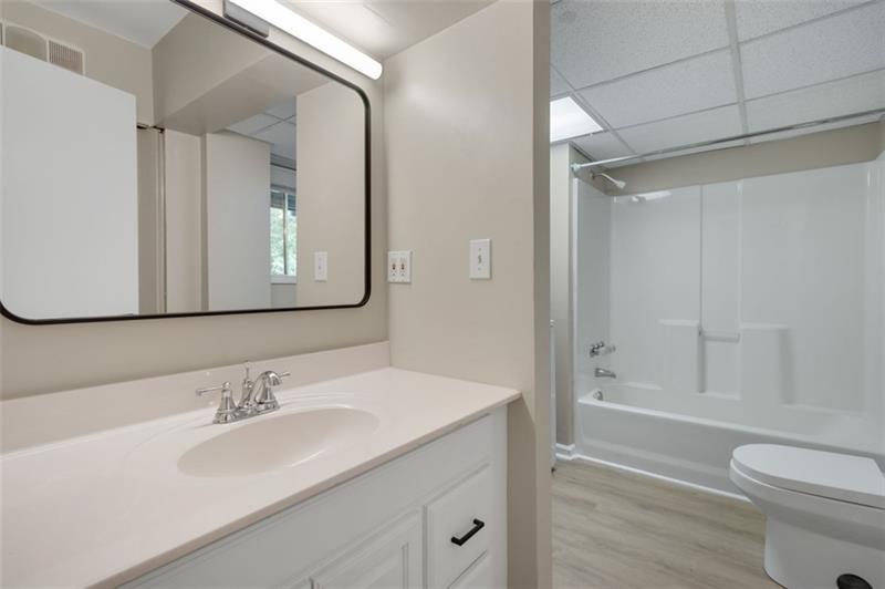 2958 Harcourt Drive Decatur, GA 30033 - Photo 6 of 11 a bathroom with a sink toilet vanity and shower