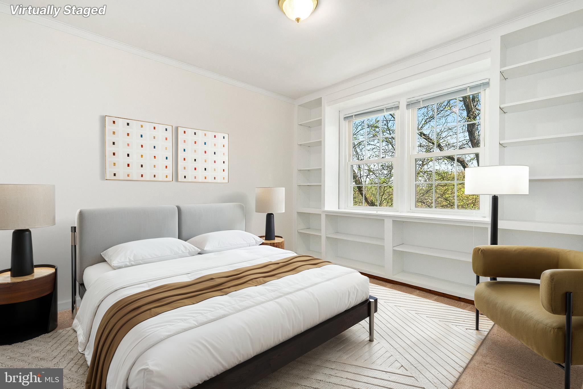 2211 Washington Avenue, Unit 303 Silver Spring, MD 20910 - Photo 12 of 28 a bedroom with a bed and a window