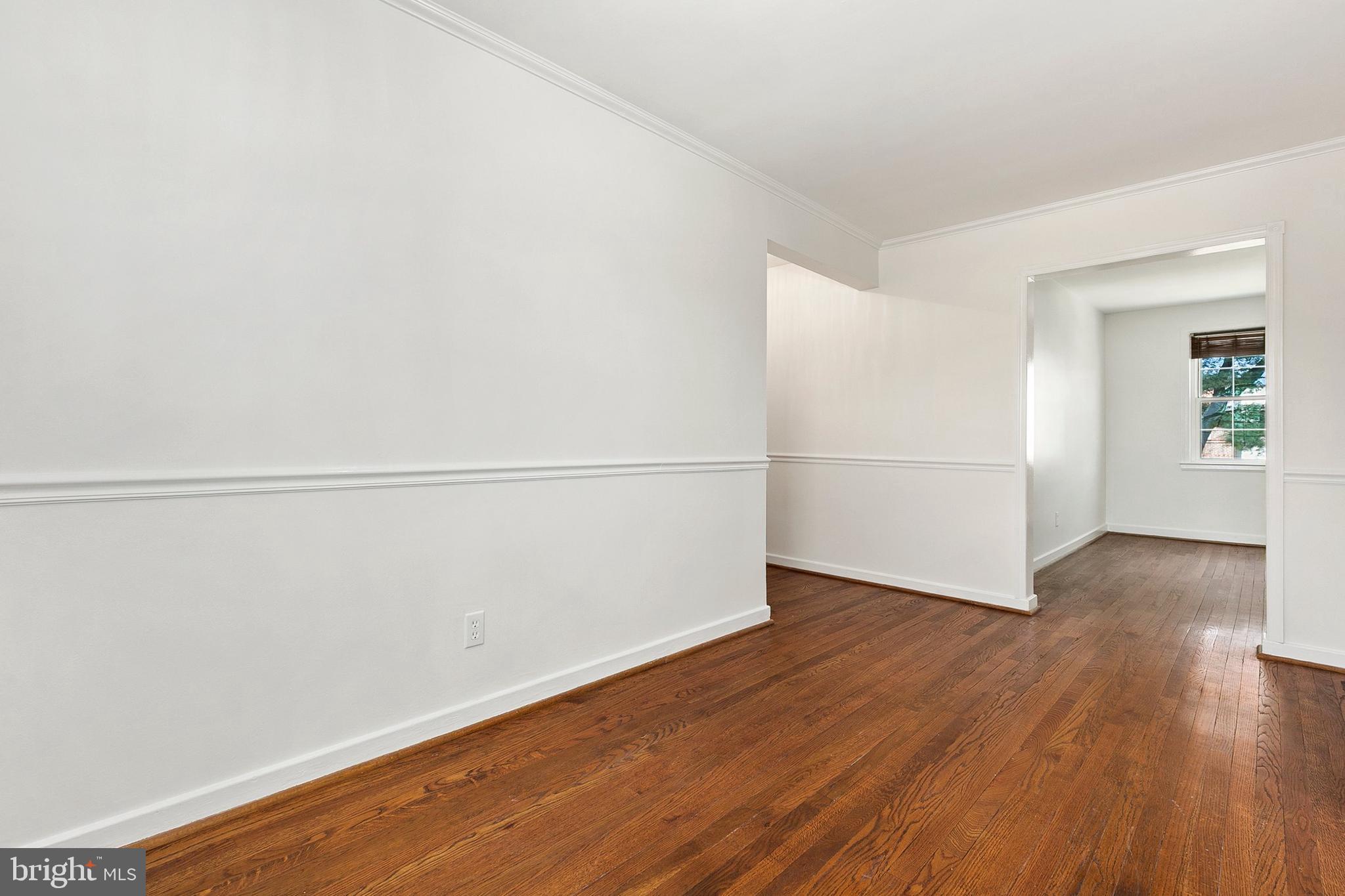 2211 Washington Avenue, Unit 303 Silver Spring, MD 20910 - Photo 21 of 28 an empty room with wooden floor