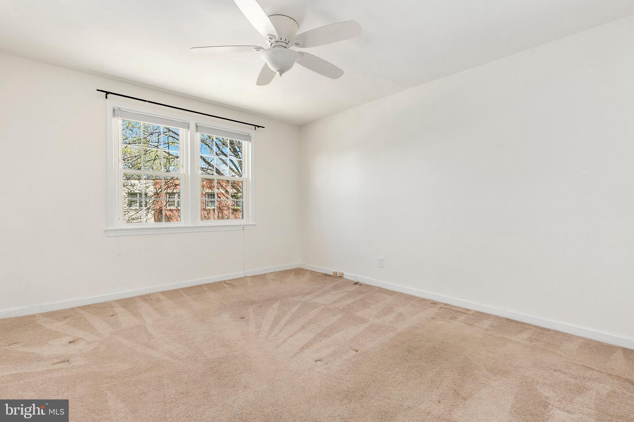 2211 Washington Avenue, Unit 303 Silver Spring, MD 20910 - Photo 22 of 28 an empty room with windows and fan